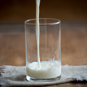 Milk being poured into a glass.
