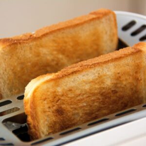 Tow toasts in a toaster.